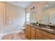 Bathroom with double vanity, granite countertop and wood-look flooring at St, Saint George, SC 29477