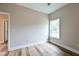 Neutral bedroom with a bright window and wood-look flooring at St, Saint George, SC 29477