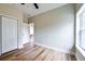 Bright bedroom with closet and wood-look flooring at St, Saint George, SC 29477
