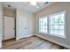 Bright bedroom with wood-look flooring and large windows at St, Saint George, SC 29477