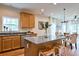 Open-concept kitchen island with bar stool seating, granite countertops, and stainless steel appliances at St, Saint George, SC 29477