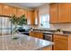 Well-lit kitchen featuring granite countertops and stainless steel appliances at St, Saint George, SC 29477