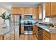 Modern kitchen with stainless steel appliances, granite countertops, and ample cabinet space for storage at St, Saint George, SC 29477