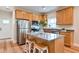 Well-equipped kitchen with stainless steel appliances, granite countertops, and island seating for casual dining at St, Saint George, SC 29477