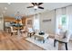 Inviting living space with hardwood floors, comfortable seating, and a view into the adjacent modern kitchen at St, Saint George, SC 29477