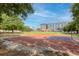 Outdoor basketball court surrounded by lush greenery, providing an active recreational space at 1 Cool Blow St # 124, Charleston, SC 29403