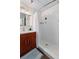 Bathroom with white subway tile shower, wood vanity, and chrome fixtures at 1 Cool Blow St # 124, Charleston, SC 29403