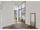 Bedroom with a large window, exposed ceiling and hardwood style floor at 1 Cool Blow St # 124, Charleston, SC 29403