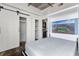 Bedroom with a sliding barn door, murphy bed and laundry area at 1 Cool Blow St # 124, Charleston, SC 29403