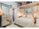 Cozy bedroom with a plush bed, mirrored dresser and overhead storage at 1 Cool Blow St # 124, Charleston, SC 29403