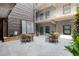 Charming courtyard with outdoor seating and green accents, perfect for relaxing and entertaining at 1 Cool Blow St # 124, Charleston, SC 29403