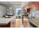 Modern kitchen featuring stainless steel appliances, granite countertops and hardwood floors and island seating at 1 Cool Blow St # 124, Charleston, SC 29403