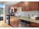 Updated kitchen features stainless steel appliances, granite countertops, and hardwood floors at 1 Cool Blow St # 124, Charleston, SC 29403