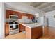 Charming kitchen featuring stainless steel appliances, ample cabinet space, and central island at 1 Cool Blow St # 124, Charleston, SC 29403