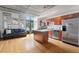 Open kitchen and living room with stainless appliances, island and hardwood floors at 1 Cool Blow St # 124, Charleston, SC 29403