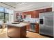 Well-appointed kitchen with stainless steel appliances, island, and adjacent dining area at 1 Cool Blow St # 124, Charleston, SC 29403