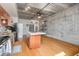 Bright open concept living space features concrete ceilings and a kitchen island at 1 Cool Blow St # 124, Charleston, SC 29403