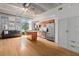 Open living room and kitchen with stainless appliances, island and hardwood floors at 1 Cool Blow St # 124, Charleston, SC 29403