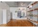 Stylish living space with hardwood floors, shelving, and bright natural light at 1 Cool Blow St # 124, Charleston, SC 29403
