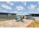 Expansive rooftop terrace with stylish furniture, string lights, and grilling area, ideal for gatherings at 1 Cool Blow St # 124, Charleston, SC 29403