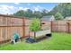Backyard garden featuring a raised garden bed, ideal for growing vegetables and flowers at 100 Runnels Cv, Summerville, SC 29485