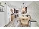 Charming dining area featuring a stylish light fixture, comfortable seating, and modern decor at 100 Runnels Cv, Summerville, SC 29485