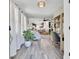 Bright foyer featuring wood-look floors, an open layout, and stylish decor at 100 Runnels Cv, Summerville, SC 29485