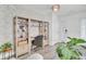 Elegant foyer with stylish wallpaper, wood floors, and natural light at 100 Runnels Cv, Summerville, SC 29485