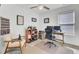 Bright home office with chair, desk, computer, shelving unit, and natural light from the window at 100 Runnels Cv, Summerville, SC 29485