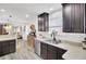 Open kitchen featuring dark wood cabinets, stainless steel appliances, and wood-look flooring at 100 Runnels Cv, Summerville, SC 29485