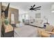 Bright living room with wood floors, neutral decor, and modern lighting at 100 Runnels Cv, Summerville, SC 29485