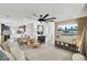 Open concept living room with wood accent wall, large fan, and modern furnishings at 100 Runnels Cv, Summerville, SC 29485