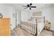 Relaxing bedroom with a ceiling fan, neutral color palette and wood-look floors at 100 Runnels Cv, Summerville, SC 29485