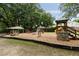 Community playground featuring play structures including a covered picnic table at 1002 Sea Gull Dr, Mount Pleasant, SC 29464