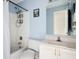Bathroom with white tile shower and a vanity with a sink and mirror at 103 Retriever Ln, Goose Creek, SC 29445