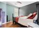 Bedroom with dark wood floors and two-tone painted walls; features a ceiling fan at 103 Retriever Ln, Goose Creek, SC 29445