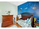 bedroom featuring a navy accent wall, hardwood floors, and wooden furniture at 103 Retriever Ln, Goose Creek, SC 29445