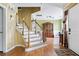 Bright foyer featuring hardwood floors and staircase leading to the second floor at 103 Retriever Ln, Goose Creek, SC 29445