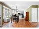 Open eat-in kitchen featuring white cabinetry, modern appliances, and wood flooring at 103 Retriever Ln, Goose Creek, SC 29445