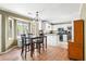 Eat-in kitchen with a bay window, dining table, and white cabinetry at 103 Retriever Ln, Goose Creek, SC 29445