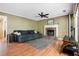 Comfortable living room with a brick fireplace, ceiling fan, and neutral color palette at 103 Retriever Ln, Goose Creek, SC 29445