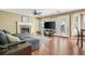Inviting living room featuring a fireplace, ceiling fan, and access to the backyard at 103 Retriever Ln, Goose Creek, SC 29445