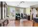 Living room featuring natural lighting, wood laminate flooring, and ample space at 103 Retriever Ln, Goose Creek, SC 29445