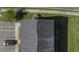 Aerial view of a roof and parking lot showcasing proximity to a nearby well manicured lawn at 1034 Lexi Ct, Ladson, SC 29456
