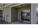 The back of this property features a sliding glass door that opens to a back porch at 1034 Lexi Ct, Ladson, SC 29456