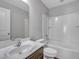 This bathroom features a vanity with a marble countertop, toilet, and shower over bath at 1034 Lexi Ct, Ladson, SC 29456