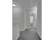 Upstairs hallway with carpet and an open doorway leading to a bedroom at 1034 Lexi Ct, Ladson, SC 29456