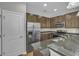 Kitchen features stainless steel appliances, granite countertops, and ample cabinet space at 1034 Lexi Ct, Ladson, SC 29456