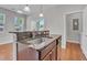 Open-concept kitchen featuring granite countertops, stainless sink, and bar seating area at 1034 Lexi Ct, Ladson, SC 29456