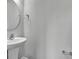 Clean powder room features pedestal sink, round mirror and modern fixtures at 1034 Lexi Ct, Ladson, SC 29456